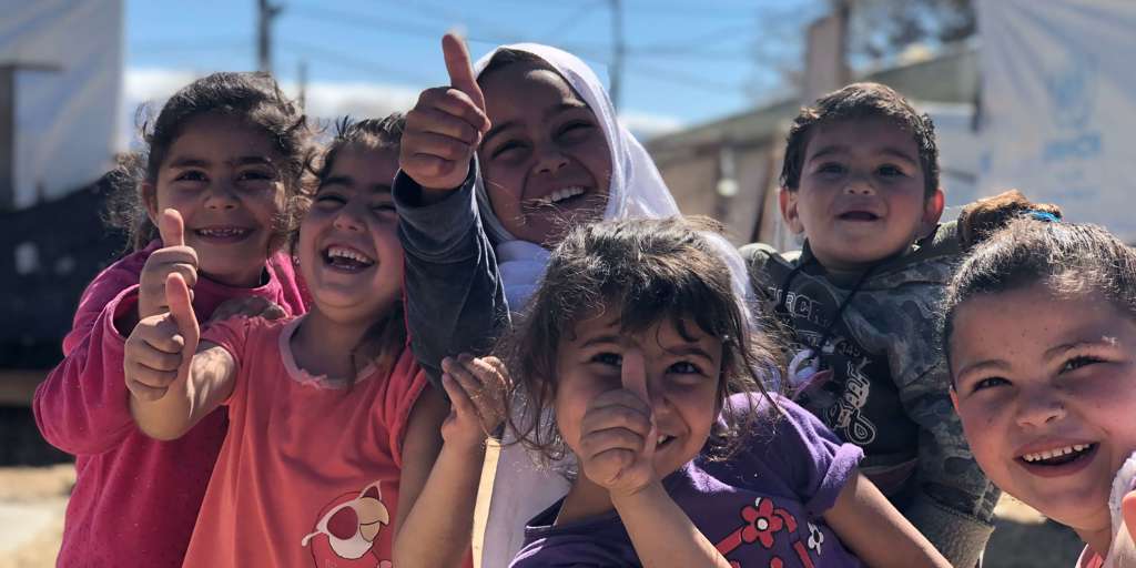 Syrian kids laugh and play at home in their informal settlement in Mhammara, northern Lebanon where 29 families live together with support from UNHCR. 
