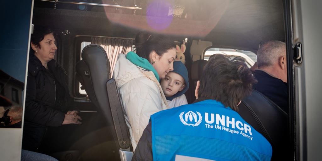 UNHCR staff meet refugees crossing from Slovenia into Italy. 