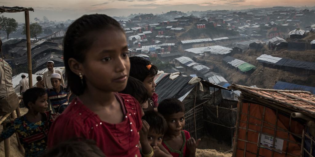 Young Rohingya refugees look out over Palong Khali refugee camp, a sprawling site located on a hilly area near the Myanmar border in south-east Bangladesh. 
