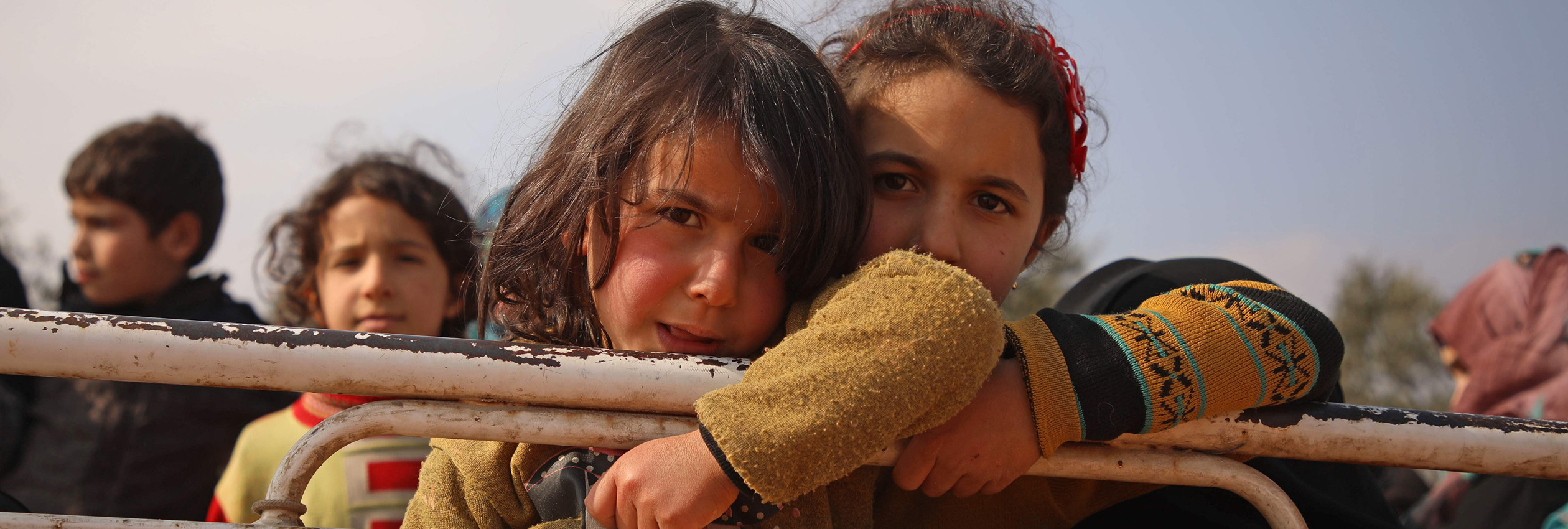 Two Syrian girls arrive at a newly established camp in Maaret Misrin in Idlib province